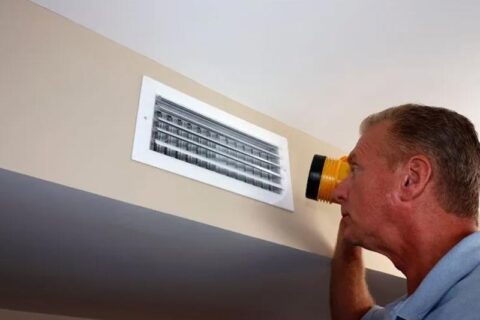 technician checking furnace