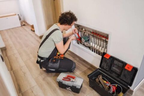 technician repairing heater