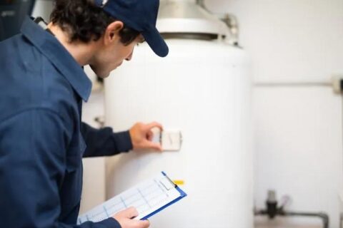 technician inspecting heater