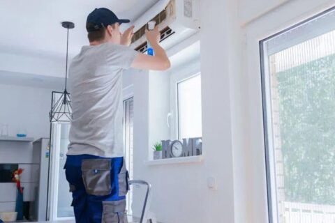 technician checking ac unit