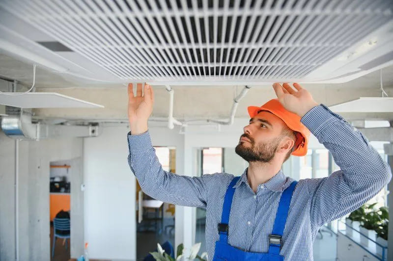 technician installing new ac unit